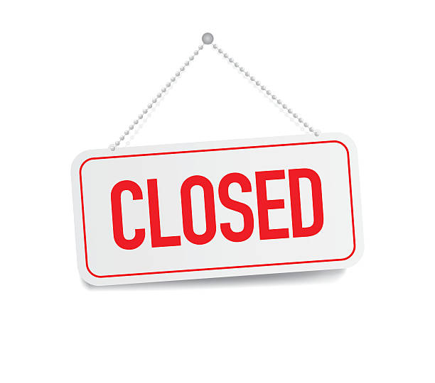 Closed sign hanging isolated on white wall